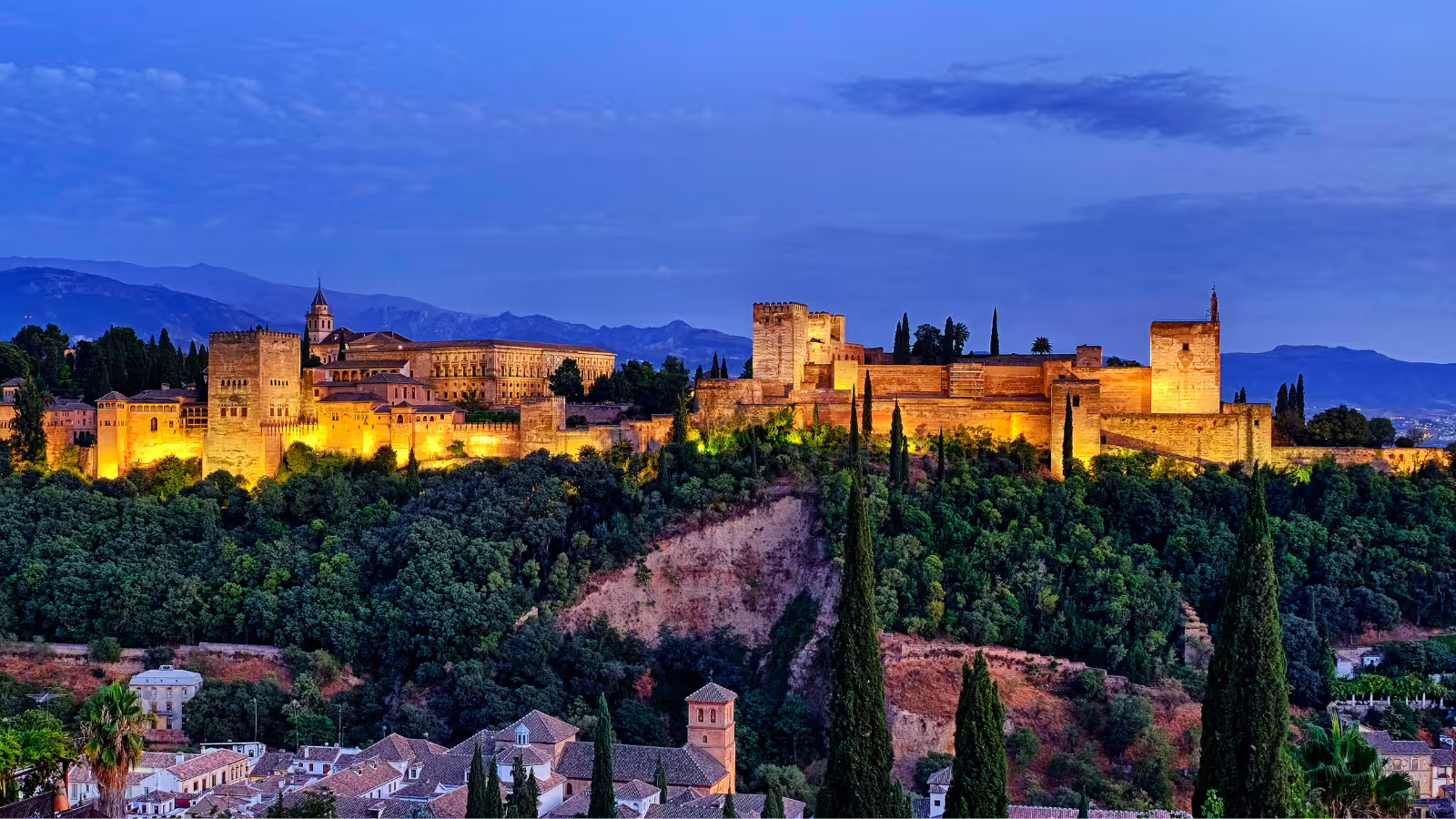 Alhambra Palace at sunset in Granada, panoramic fortress view on private tour with hotel pick-up