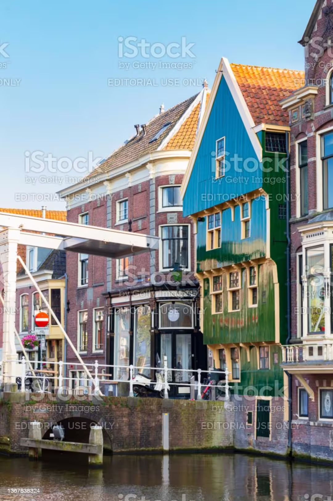 Colorful canal houses by a bridge in Alkmaar, scenic stop on a 1-day walking tour with multilingual audioguide