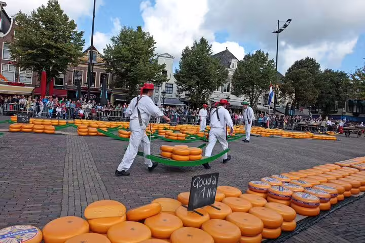 Alkmaar cheese market scene with porters carrying Gouda wheels on a self-guided GPS audio tour