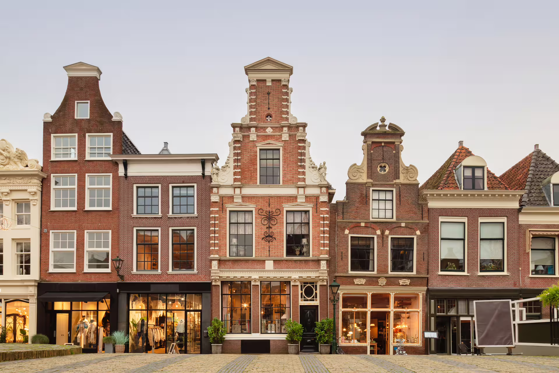 Historic gabled houses on Alkmaar’s main square, classic Dutch architecture on a self-guided walking tour audioguide