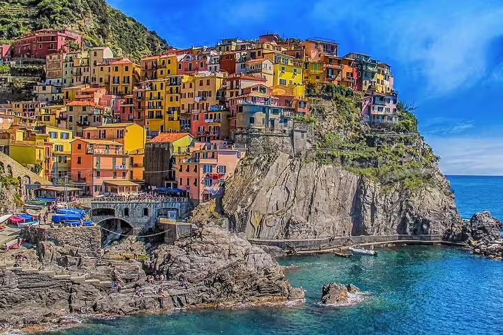 Colorful cliffside seaside village above turquoise water, perfect stop on a luxury private Amalfi Coast tour from Naples