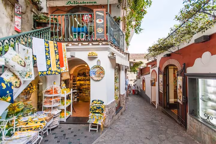 Charming Amalfi Coast shop with vibrant textiles and ceramics, perfect for exploring on a private tour from Sorrento.