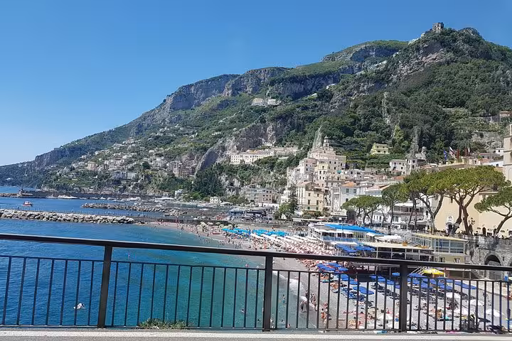 Amalfi waterfront beach and hillside town panorama, highlight of Ravello Amalfi Positano day trip from Rome
