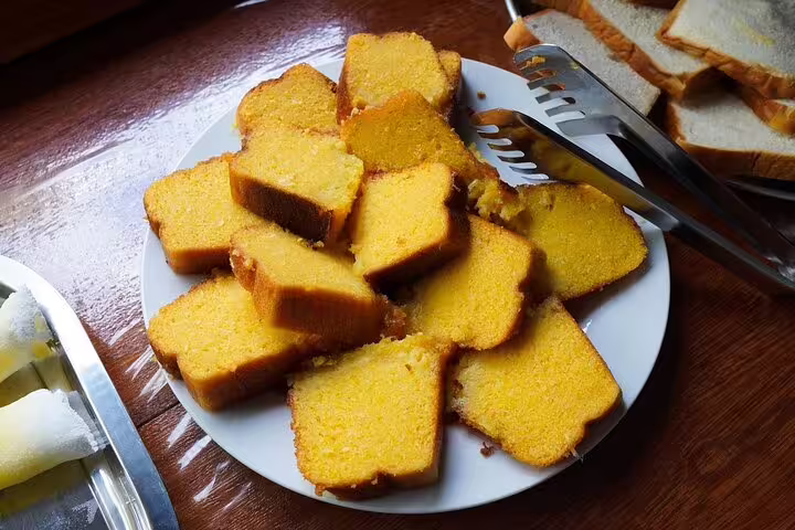 Golden slices of freshly baked cake at Amazon Mamori Lodge, offering a sweet start to your Amazon jungle tour.