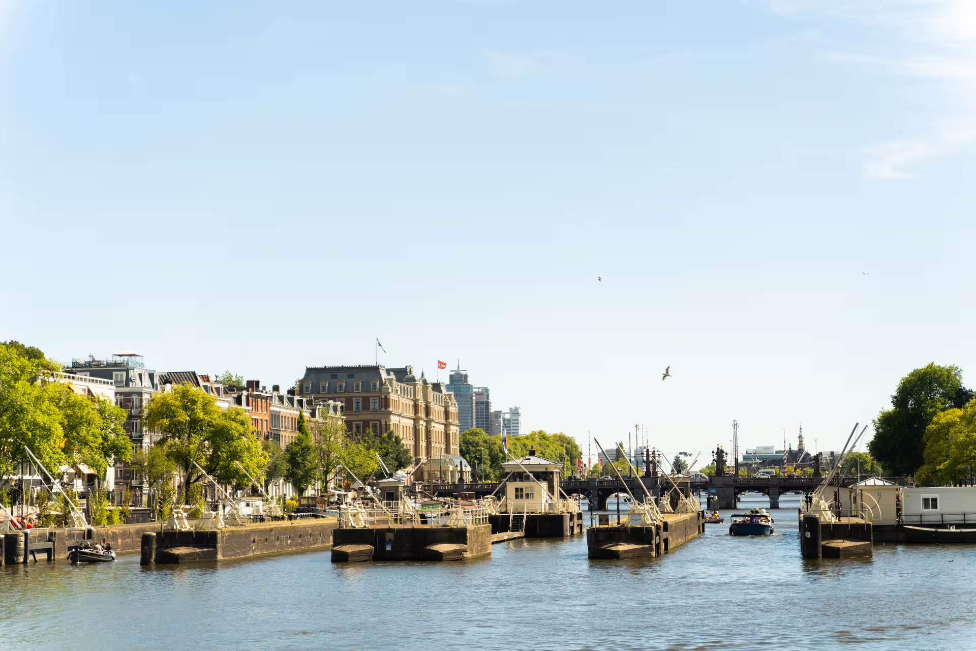 Scenic view of a canal with historic buildings and boats, perfect for a countryside private bike tour experience.
