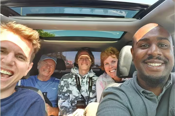 Private tour group selfie in car on day trip from Amsterdam to Zaanse Schans, Volendam and Marken