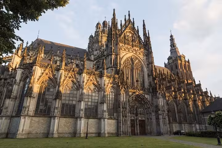 St. John's Cathedral in Den Bosch at sunset, highlight stop on Amsterdam or Schiphol private transfer service