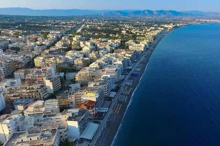 Aerial view of Corinth coastline and seaside town, scenic stop on Ancient Corinth full-day private tour