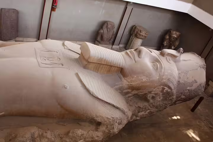 Ancient Egyptian stone sarcophagus statue at Memphis open-air museum on Memphis and Saqqara day tour