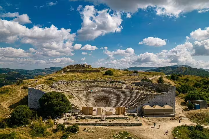 Ancient Greek theater at Segesta under a vibrant sky, a highlight of the private day trip from Palermo to Segesta, Erice, and Salt Pans.