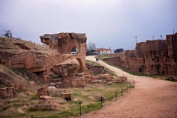 Scenic path through ancient cliff ruins and rock formations, part of an all-inclusive 10-day Mesopotamia tour