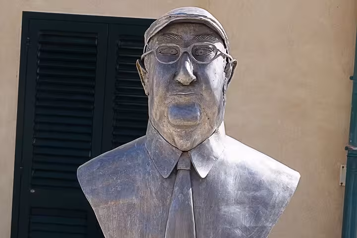 Bust of Andrea Camilleri, creator of Il Commissario Montalbano, showcasing cultural heritage in Sicilian tour.