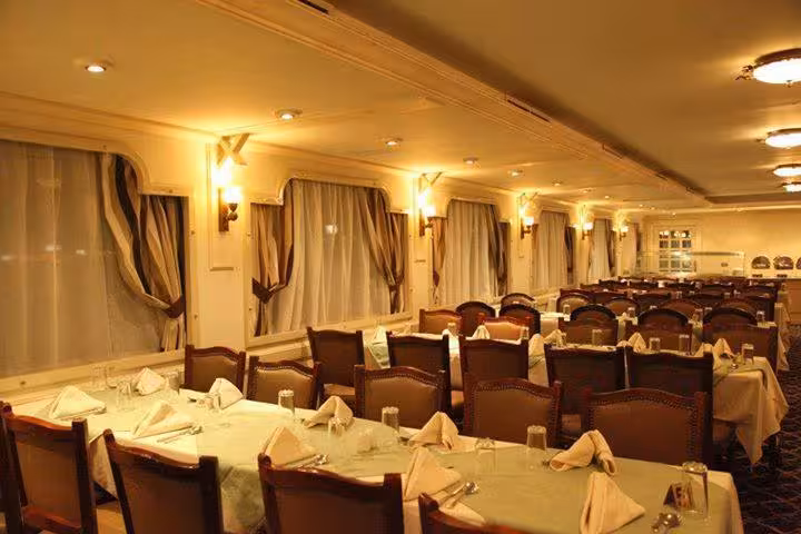 Elegant dining room on Andrea Memphis Nile cruise, set tables for lunch or dinner on Memphis tour with transfer