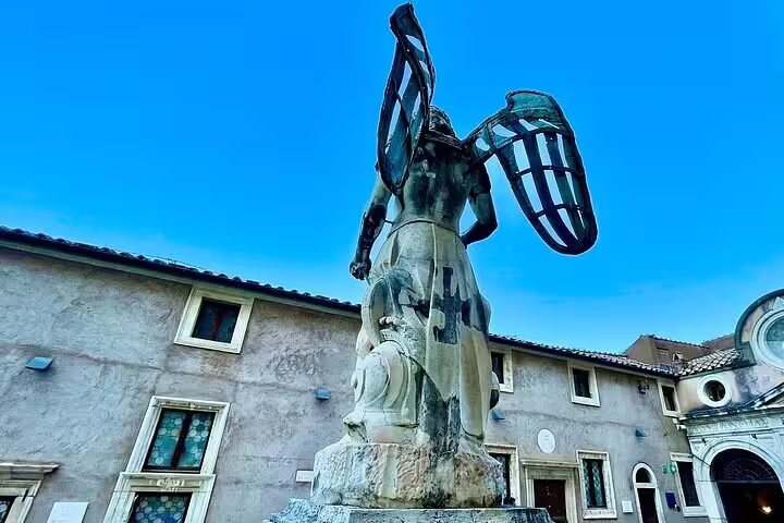 Angel statue with metal wings in the courtyard of Castel Sant’Angelo, a highlight of the St Peter’s Basilica and Dome combo tour