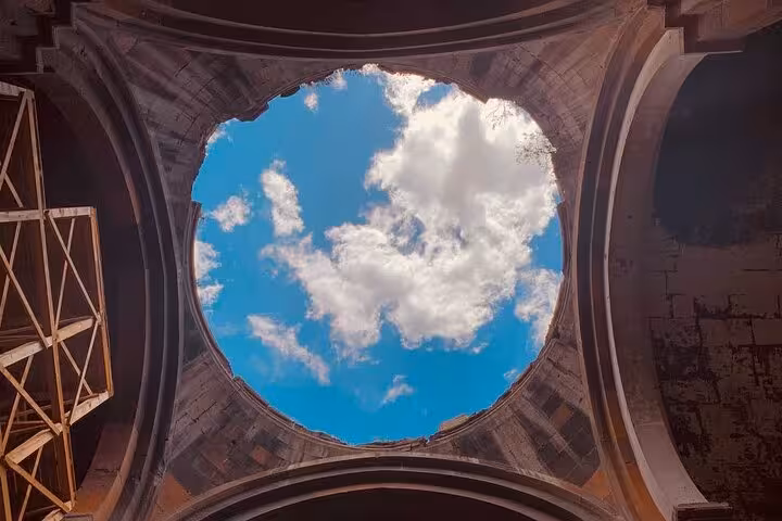 Looking up through Ani cathedral dome opening to blue sky, memorable scene on private guided 2-day Kars-Ani tour