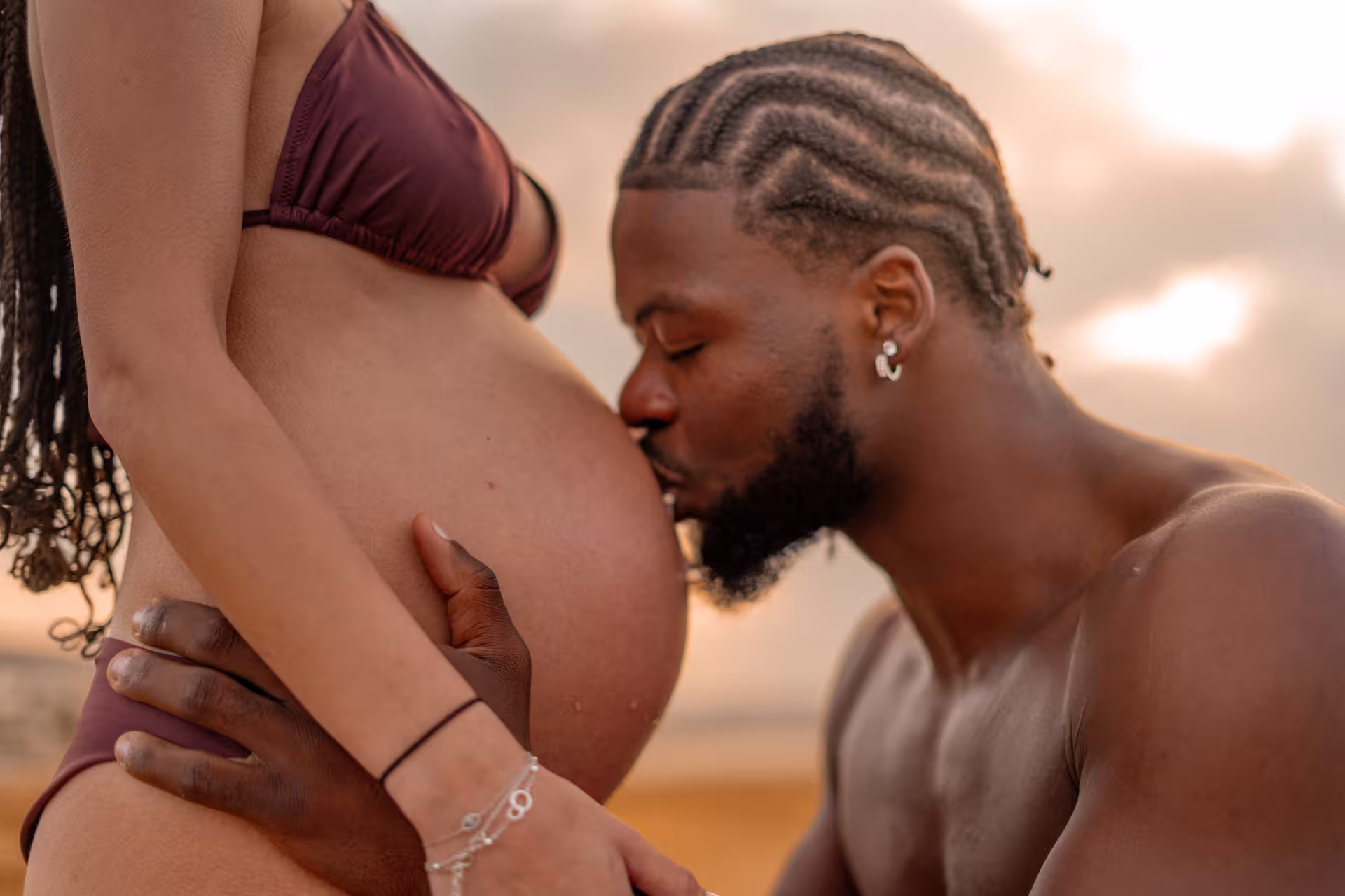 Romantic couple embracing at sunset near Heraklion Venetian Port, perfect for an anniversary photoshoot.