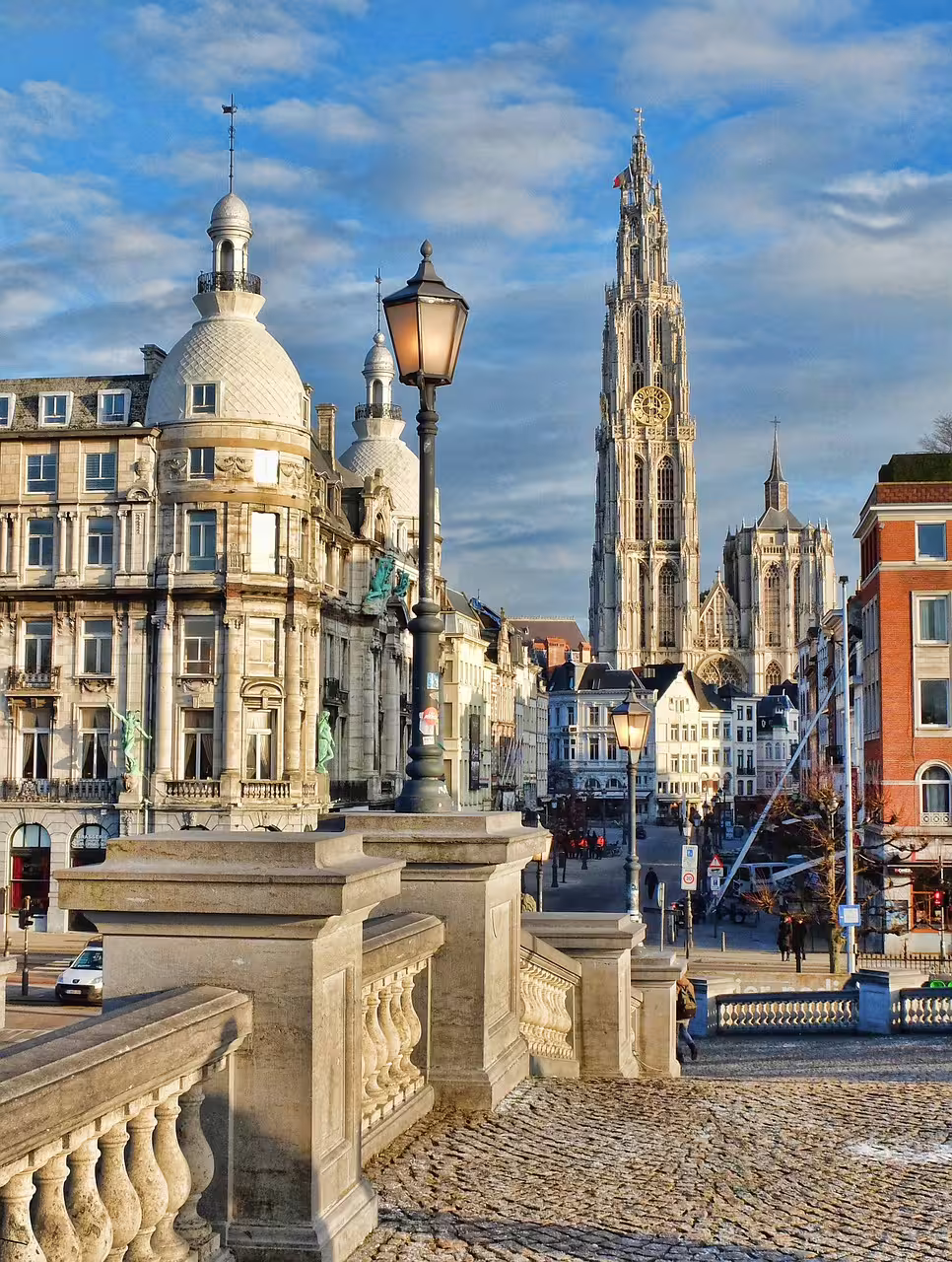 Antwerp's historic architecture and the iconic Cathedral of Our Lady are beautifully captured on a sunny day, perfect for a private walking tour.