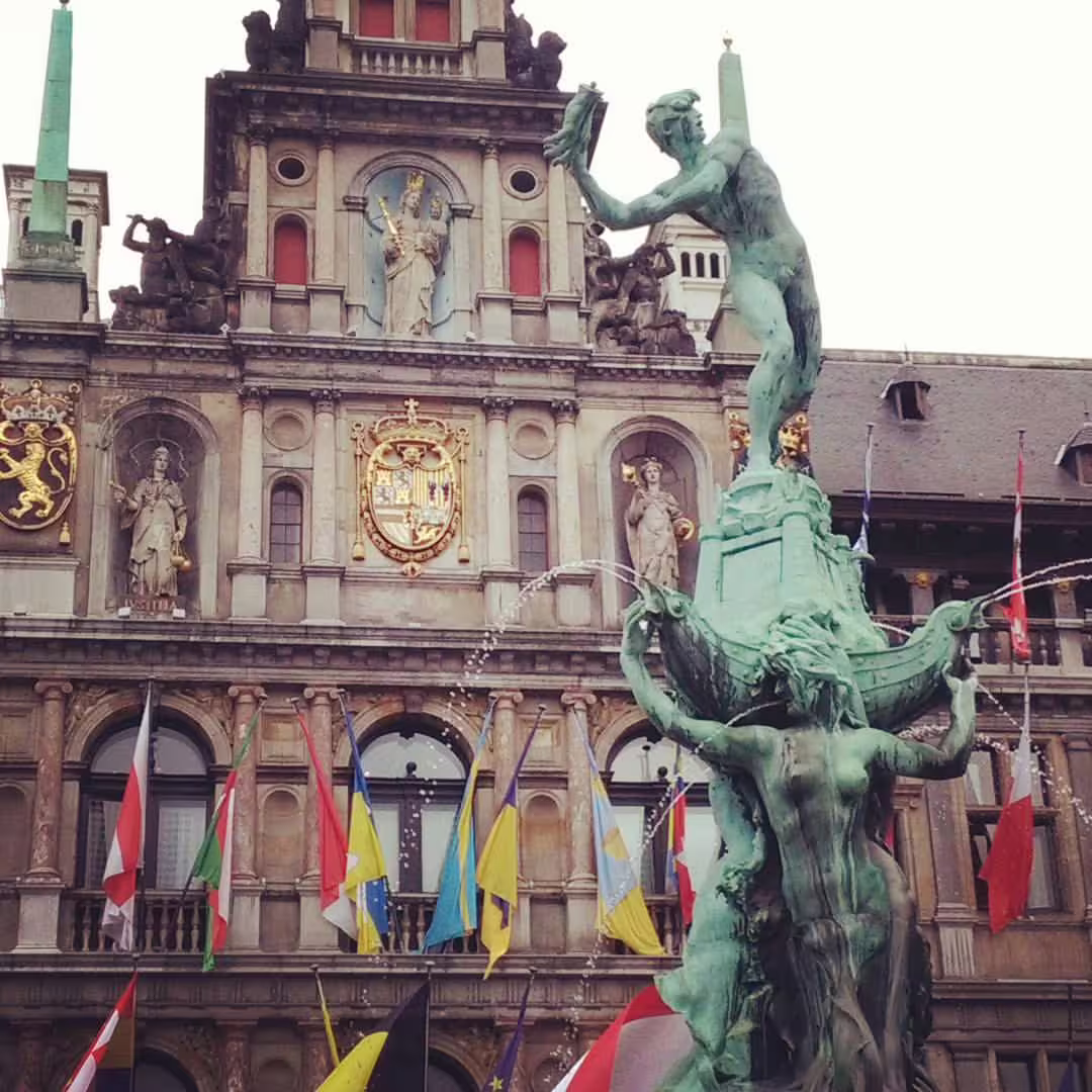 Historic Antwerp City Hall with ornate Brabo Fountain, a highlight of the private walking tour through Belgium's diamond district.