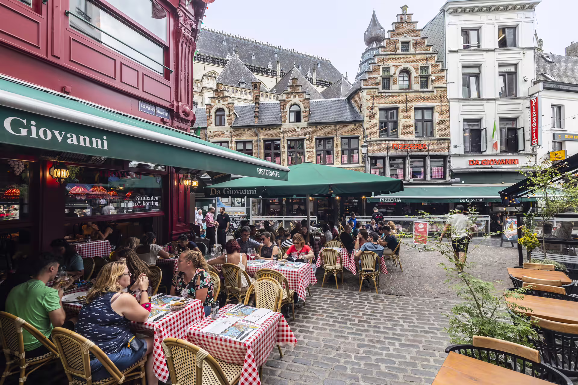 Outdoor cafes in Antwerp old town square, ideal stop on Antwerpen in 1 day walking tour with audioguide