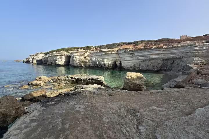 Sea caves and limestone cliffs at Aphrodite’s Beach near Bath of Aphrodite on a Cyprus winery tour