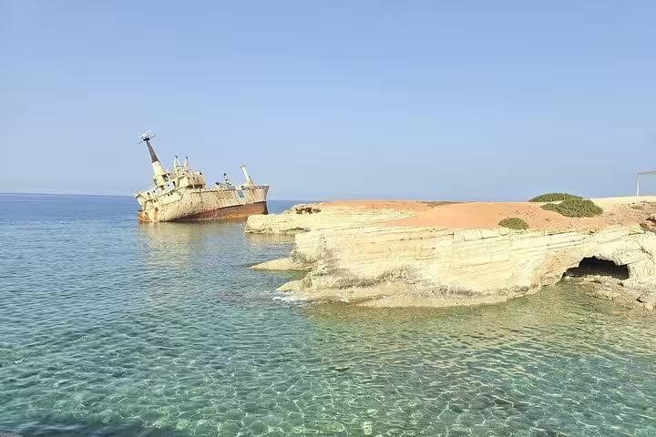 Clear turquoise water by the Edro III shipwreck, a coastal stop on the Aphrodite Experience winery tour