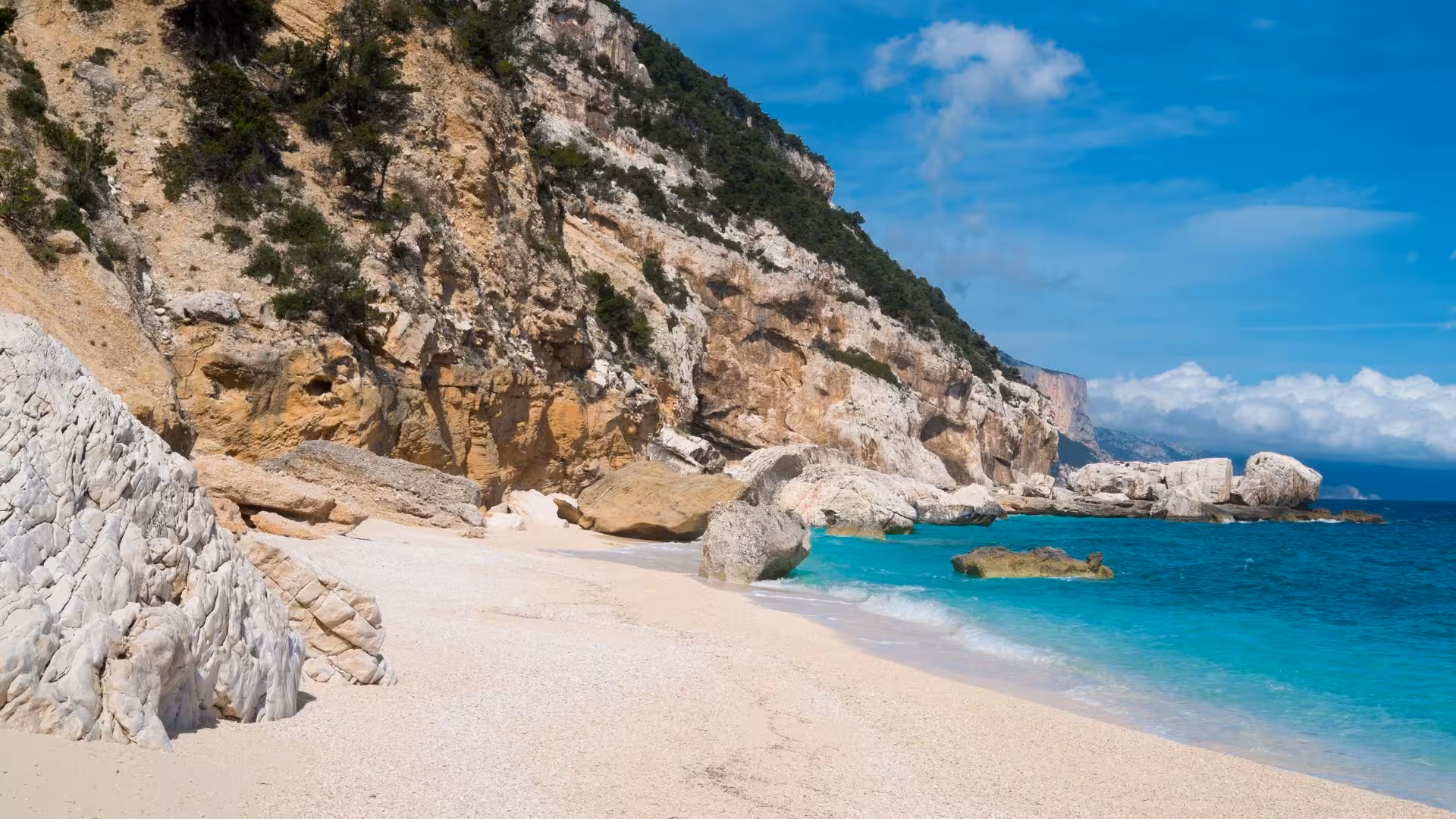 Stunning Cala Mariolu beach with turquoise waters and rugged cliffs, ideal for a RIB tour from Arbatax in Sardinia.
