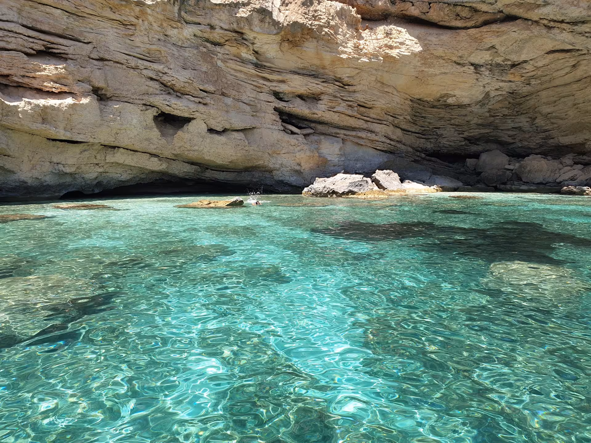 Crystal-clear waters and rugged cliffs in the Gulf of Orosei, perfect for a serene Arbatax sailing tour.