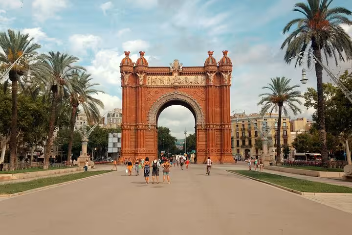 Arc de Triomf in Barcelona with palm-lined promenade, stop on a full-day panoramic private vehicle tour