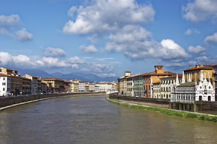 Arno River view in Pisa on a self-guided e-scavenger hunt, exploring historic buildings and city sights