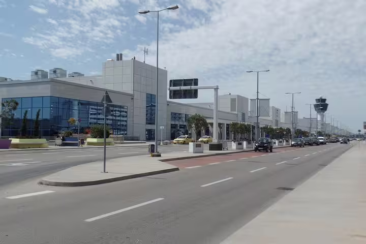 Roadside view of Athens Airport terminal and traffic, private transfer arrival from Piraeus port or Athens hotels