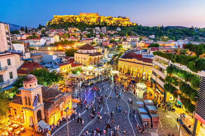 Monastiraki Square evening crowds with Acropolis lit above, Athens center stop from Athens airport private arrival transfer