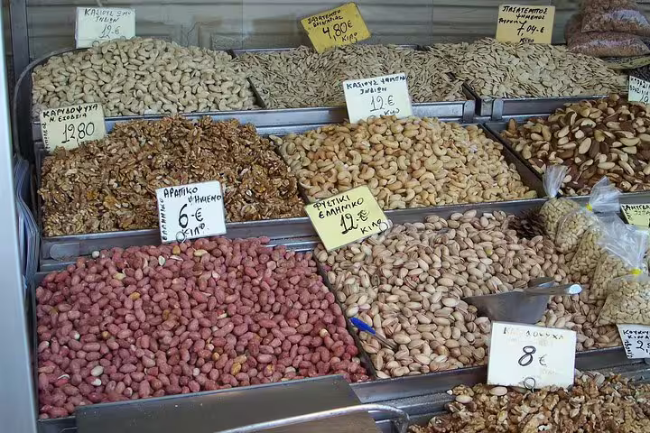 Colorful bins of Greek nuts and dried fruits at Athens market, featured on a small-group food tour