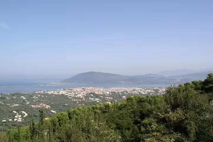 Panoramic Lefkada coast and green hills near Nikiana, destination view for Athens to Nikiana private transfer