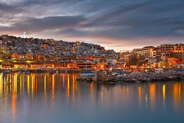 Athens Riviera harbor at dusk with waterfront lights, scenic photo stop on Best of Athens private full-day tour