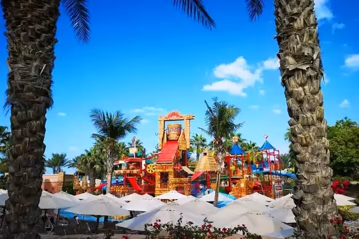 Aquaventure Waterpark Dubai kids splash area at Atlantis with palm trees and sun loungers, Super Pass