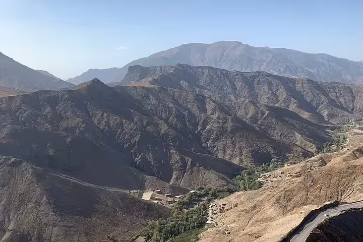 Stunning view of the rugged Atlas Mountains on a clear day, perfect for 4-day tours from Fes to Marrakech via Merzouga.