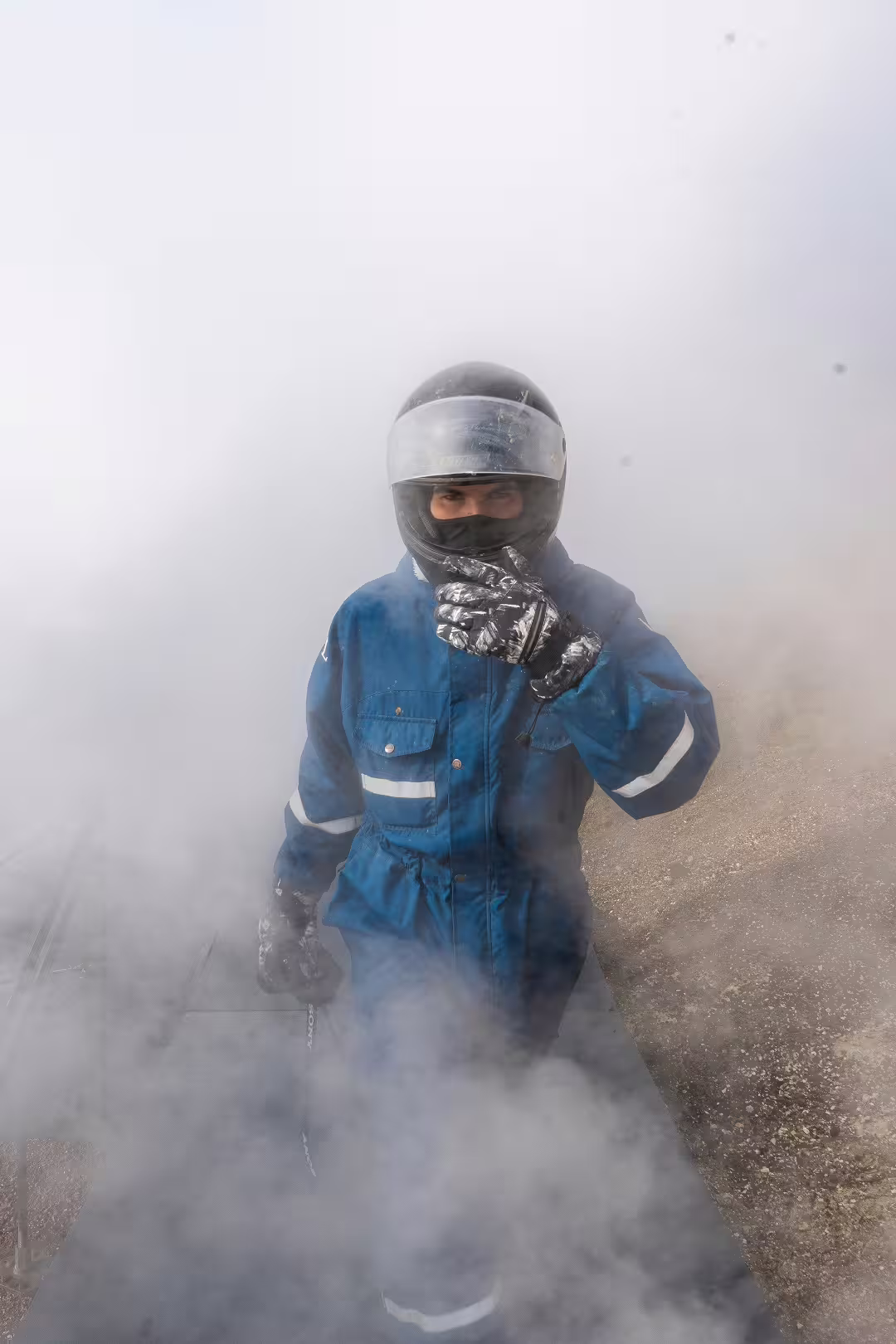 ATV rider in protective gear exploring misty volcanic springs during a thrilling 3-hour adventure tour.
