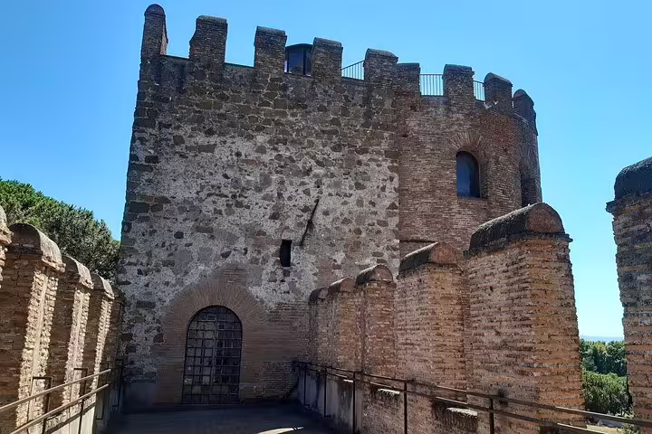 Ancient brick watchtower on the Aurelian Walls in Rome, seen from the ramparts during a family-friendly kids history tour
