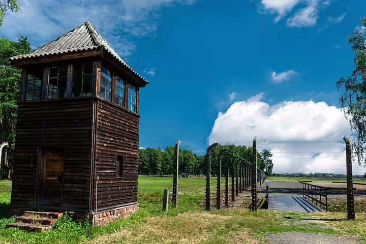 Auschwitz-Birkenau watchtower and barbed-wire fence on private round-trip tour from Krakow