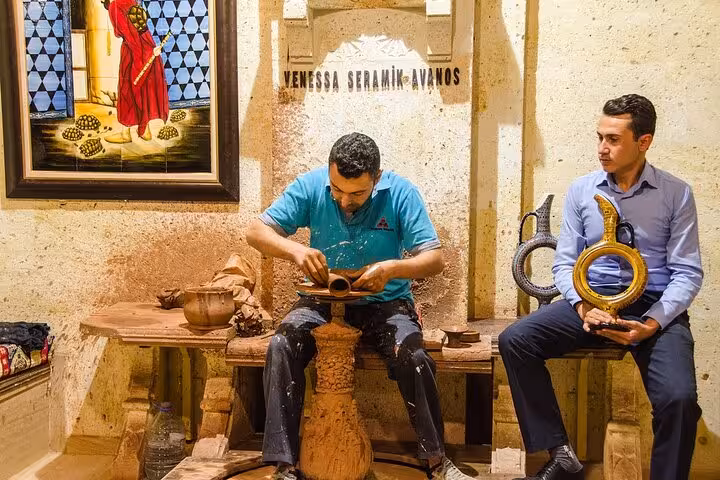 Avanos pottery workshop demo on Cappadocia shopping tour, artisan shaping clay and handmade ceramics