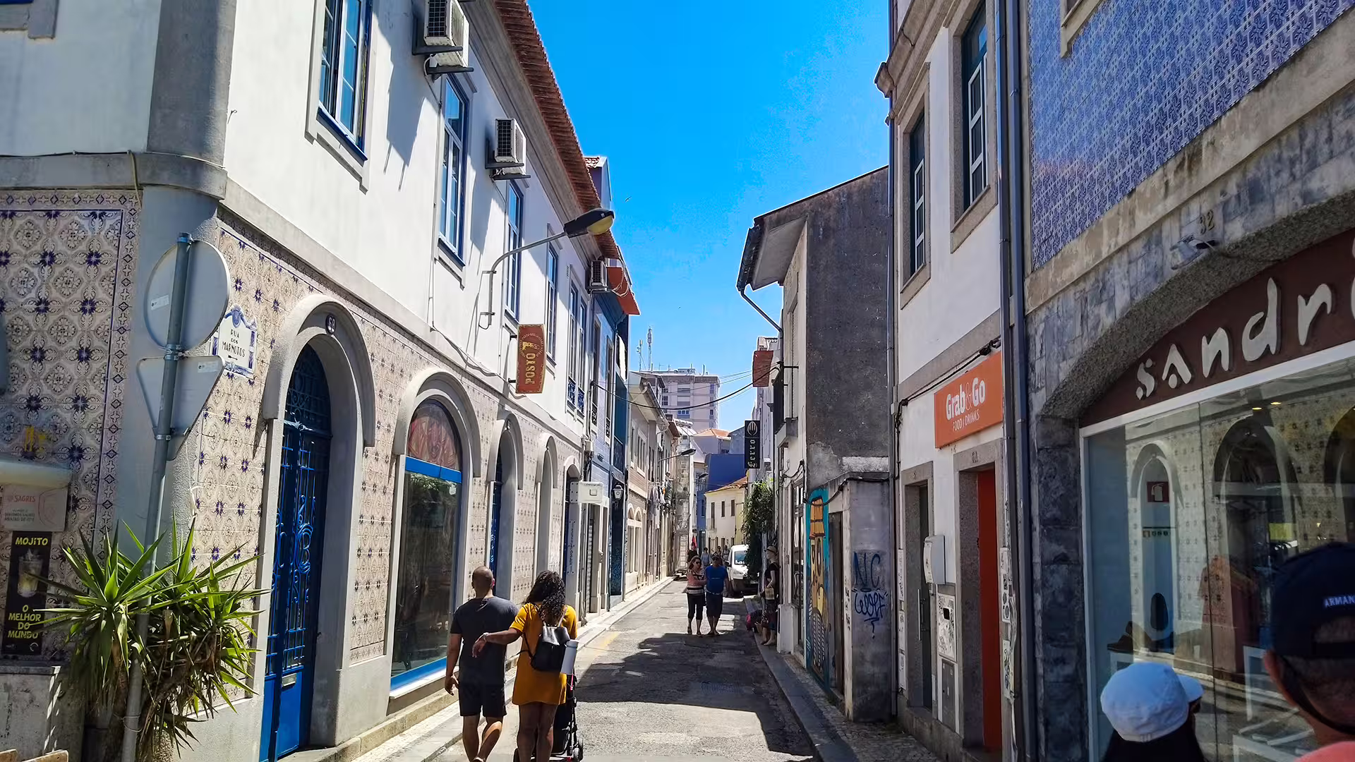 Charming street view in Aveiro with traditional Portuguese architecture, perfect for a Costa Nova striped houses private tour.