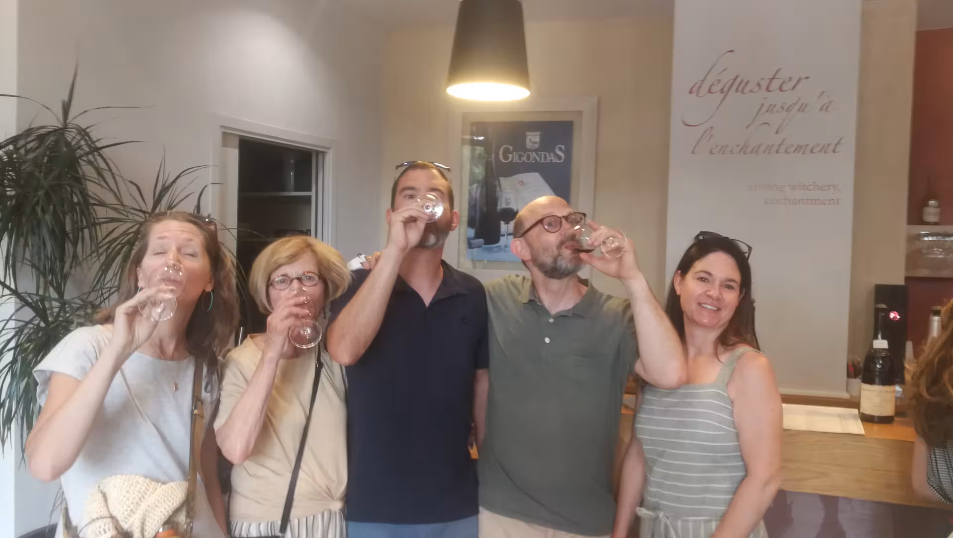 Guests tasting Rhône Valley reds in Avignon winery, Châteauneuf-du-Pape, Gigondas and Séguret tour experience