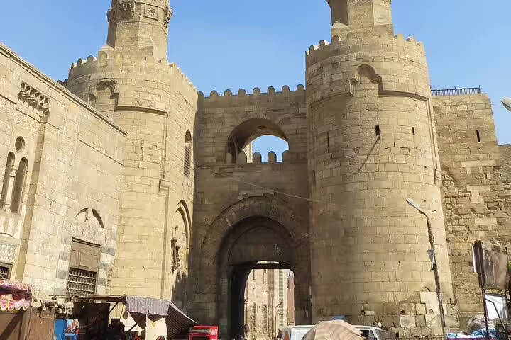 Bab Zuweila gate on Al-Mu'izz Street, Islamic Cairo fortress entrance visited on tour with dinner