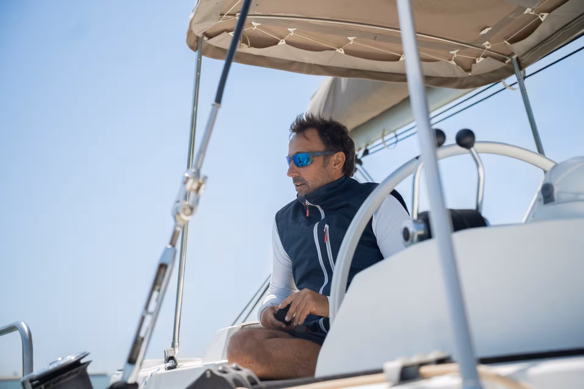 Skipper at the helm on Bali 4.2 luxury catamaran during a 4-hour private Barcelona sailing tour