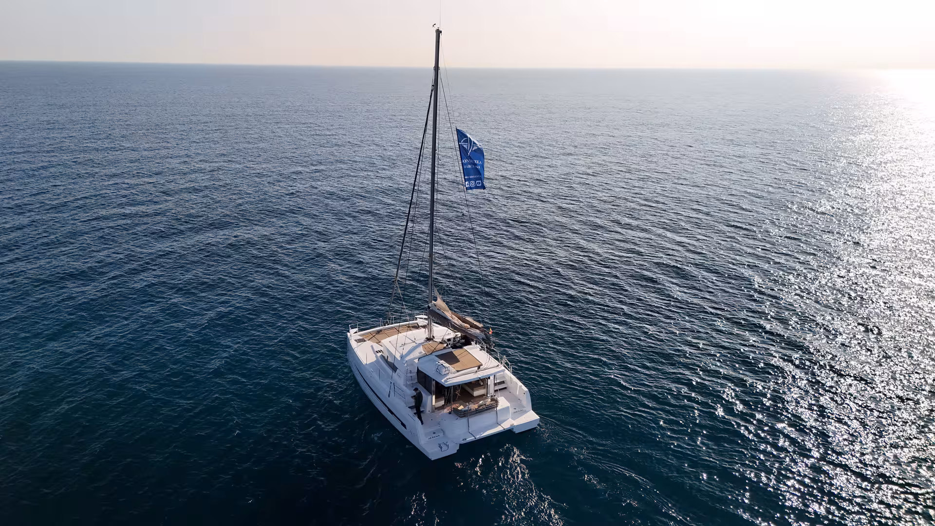 Aerial view of Bali 4.2 private luxury catamaran sailing off Barcelona on a 2-hour Mediterranean charter