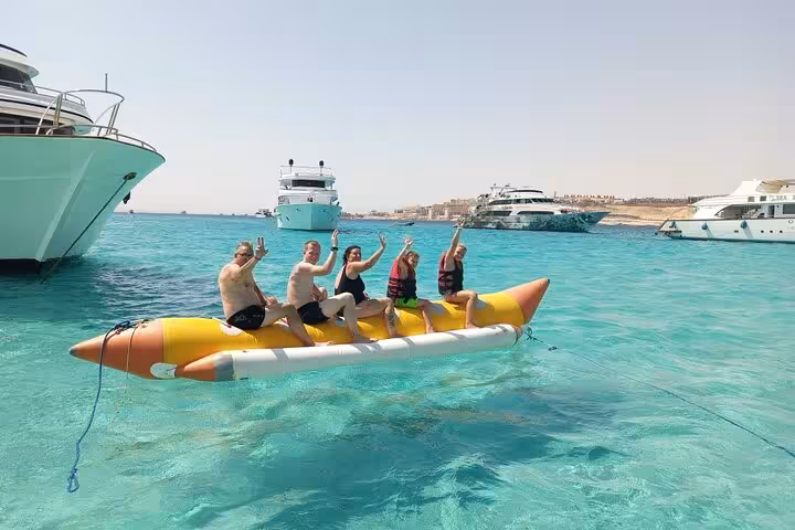Banana boat fun in crystal-clear Hurghada waters on Hula Hula Island sailing and snorkeling trip