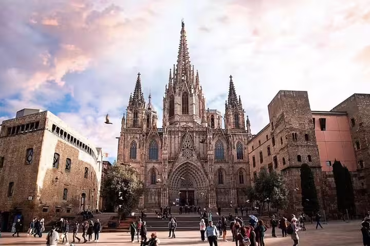 Explore the stunning Gothic architecture of Barcelona Cathedral on a private walking tour with tapas and flamenco.