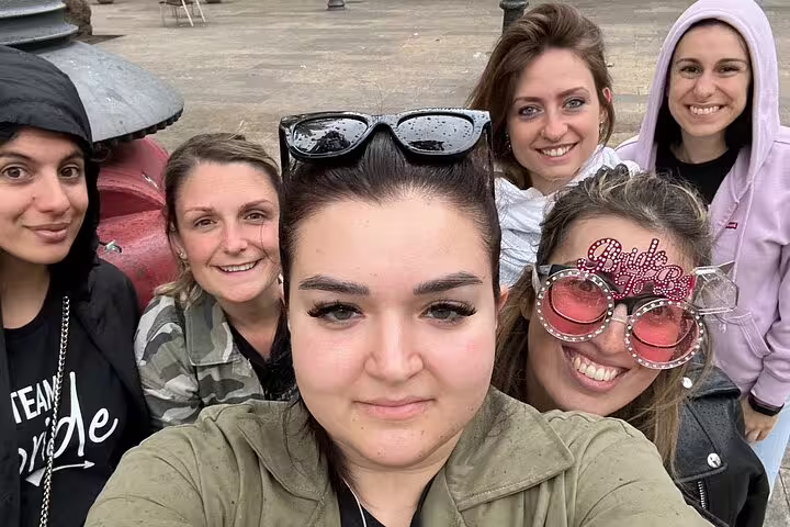 Friends group selfie in Barcelona Gothic Quarter on a scavenger hunt city highlights walking tour adventure
