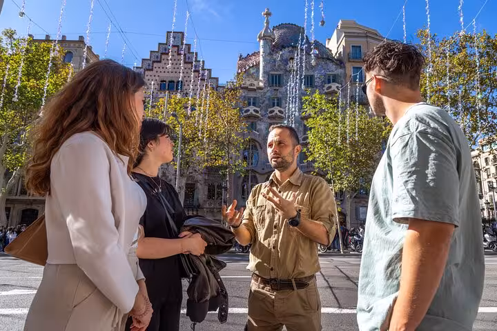 Local guide leads a small group at Casa Batlló on Passeig de Gràcia, Barcelona highlights walking tour