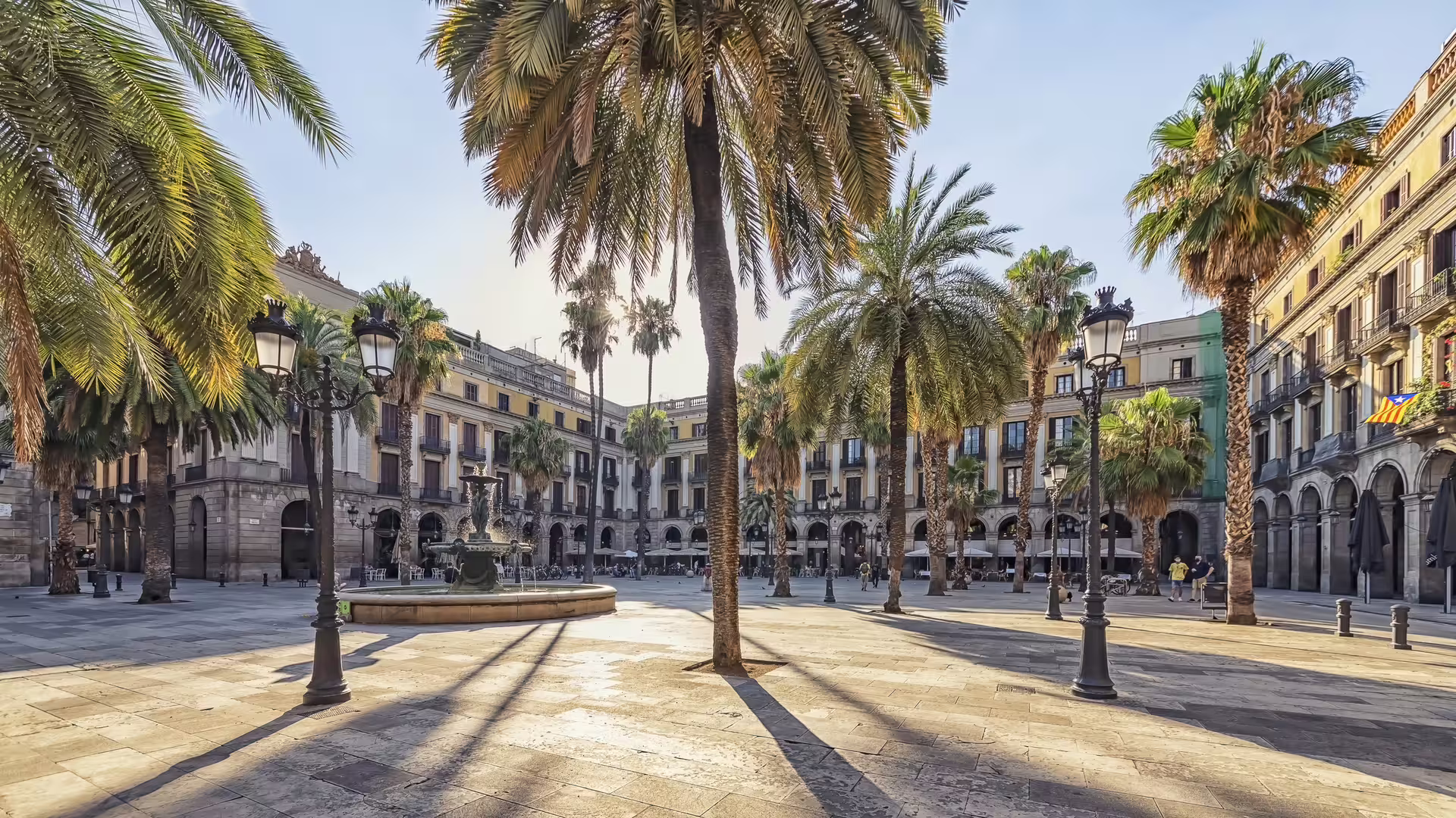 Palm-lined Plaça Reial by La Rambla in Barcelona’s El Raval, featured on 1-day walking tour audioguide